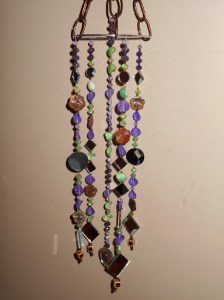 Even without sparkle from sunshine, the suncatcher is pretty. This could hang in a window 