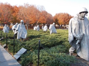 Larger-than-life warriors framed by contrasting fall foliage