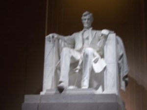 Serene above the milling crowds below